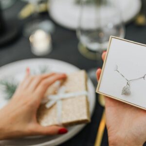 A delicate necklace in a gift box, perfect for holiday celebrations.