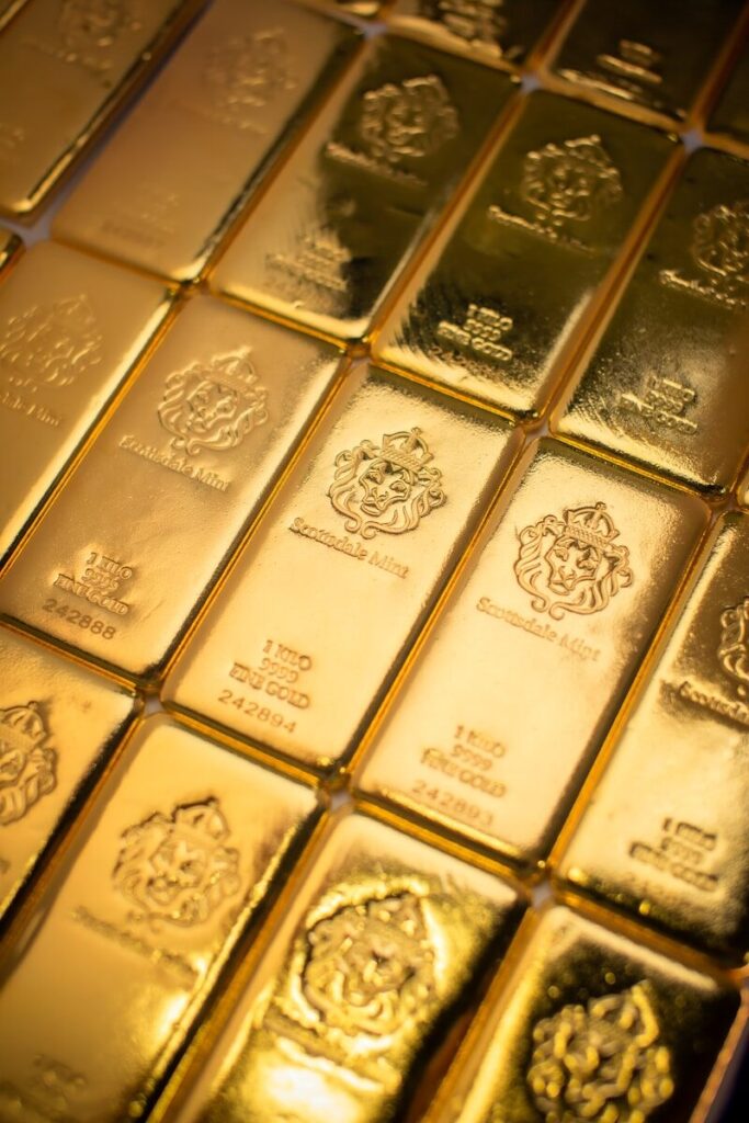 A pile of gold bars sitting on top of a table